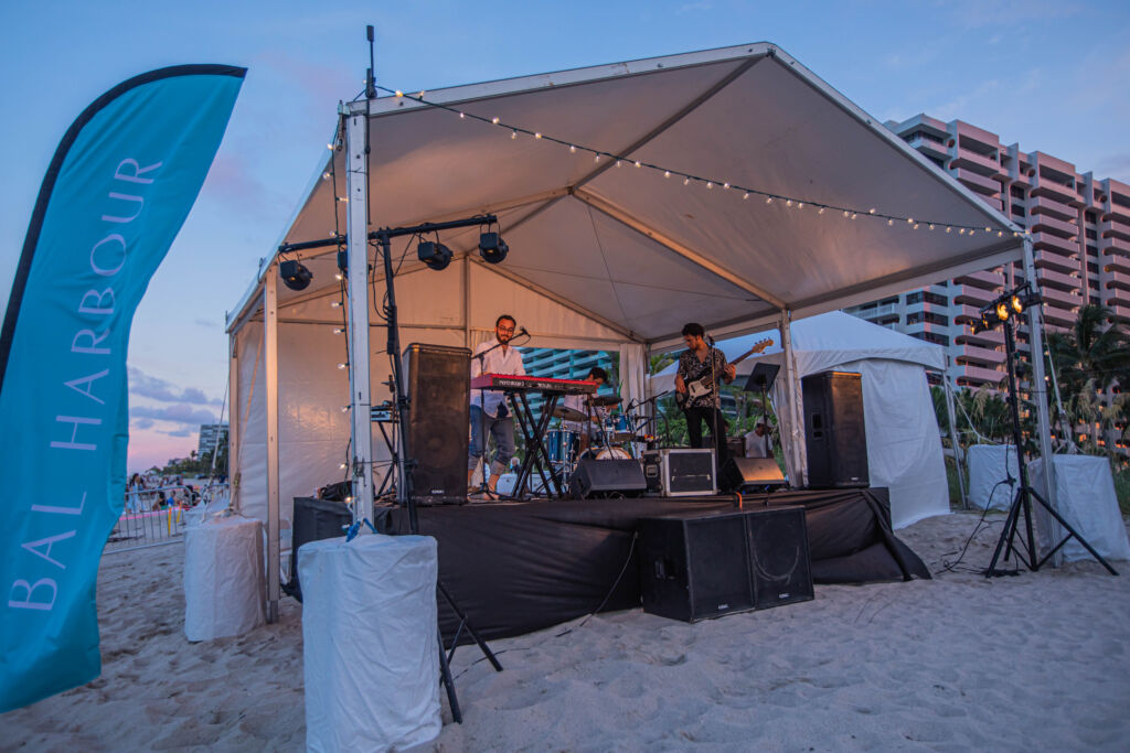 Band performing on stage at the beach