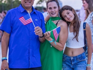 BH 4th of July 2023 319 Family of three smiling for a picture.