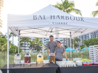 BH 4th of July 2023 35 Two event workers posing for a picture under a tent.