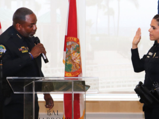 BHV 6-15-23 24a Police officer swearing in during a police department ceremony.