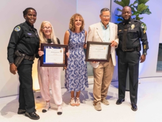 BAL_HARBOR_POLICE-105 People taking a picture with their certificate from the gala.