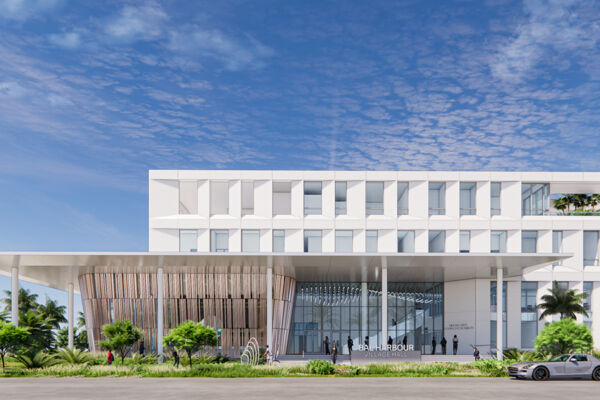 Modern four-story building with a sleek white facade, bordered by palm trees. U.S. and Florida flags wave in front. Clear blue sky above, creating an elegant atmosphere.